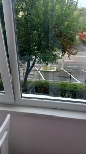 a window with a view of a street at Apartament Brasov in Braşov