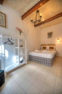 a bedroom with a bed in a room at Charming house in the heart of Valletta CPAC1-3 in Valletta