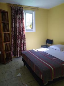 Postel nebo postele na pokoji v ubytování OLATIKA - gîte des cascades