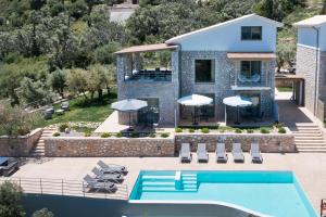 an aerial view of a villa with a swimming pool at Mylos Mountain Villas- Villa Giorgio in Agios Nikitas
