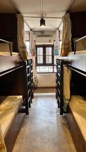 a room with many bunk beds in a room at Baan Heart Thai in Chiang Mai