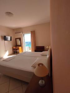 A bed or beds in a room at Miloni Studios
