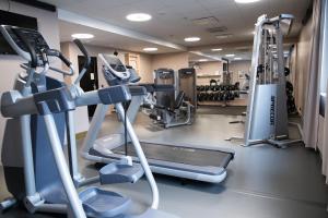 a gym with treadmills and machines in a room at Original Sokos Hotel Vaakuna Seinäjoki in Seinäjoki