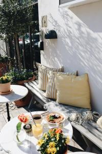 a table with two plates of food on a patio at Kalk Hotel in Visby