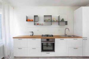 Η κουζίνα ή μικρή κουζίνα στο Amadeus Apartment: a due passi dal Duomo