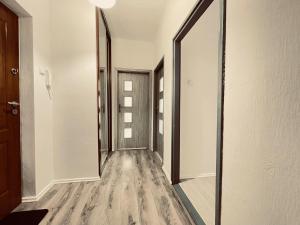 a hallway with a mirror and a door at EASY RENT- Lublin Chopina CityCentre Free Parking 24h Check-in in Lublin +11 photos