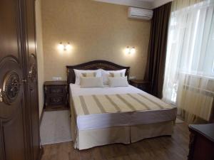 
Кровать или кровати в номере Отель Zara
