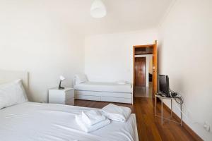 Postel nebo postele na pokoji v ubytování GuestReady - Chic relaxation in the suburbs