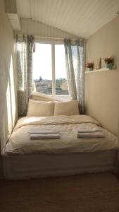 a bedroom with a large bed with a window at Casa Di Datca in Datca +34 photos