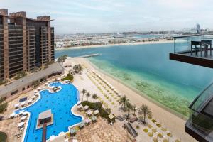 a view of the beach and the ocean from a building at Tanzanite Residence Palm Jumeirah- 2BR & Maids Room - Allsopp&Alsopp in Dubai