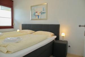 Postel nebo postele na pokoji v ubytování Grömitz- Center II App 04 inkl WLAN