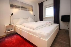 Voodi või voodid majutusasutuse Am Brandungsbad App 3 5 inkl WLAN toas