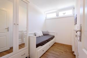 Postel nebo postele na pokoji v ubytování Hamburger Straße 4 Whg 3 inkl WLAN + 2 fotografie