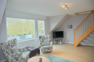 Televiisor ja/või meelelahutuskeskus majutusasutuses Haus Carolin App 3 inkl WLAN