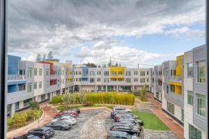 an apartment complex with cars parked in a parking lot at Palo Alto 2BR w WD Pool Spa nr Pinterest SFO-942 in Palo Alto