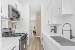 a white kitchen with a stove and a sink at Westwood 2BR nr Westwood Village LAX-902 in Los Angeles