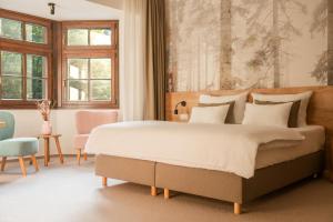 Llit o llits en una habitació de Hotel Soyka