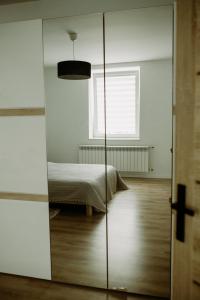 Łóżko lub łóżka w pokoju w obiekcie Apartament Magnolia -centrum