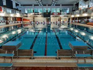 a large swimming pool in a large building at Volenter Lux Duna Spa in Baja
