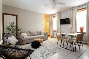 a living room with a couch and a table at Spacious Stay near Yale in Downtown New Haven in New Haven