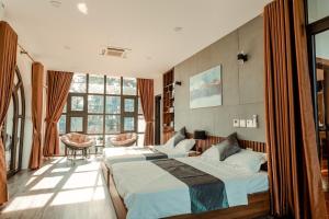 Postel nebo postele na pokoji v ubytování Đồng Chanh Villa Venuestay + 32 fotografií