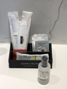 a box of beauty products and a bottle of perfume at Soho Hotel in Busan