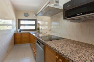 A kitchen or kitchenette at 21 Sleeps Private Pool Villa & BBQ Near Barcelona
