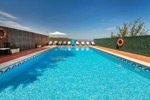 The swimming pool at or close to 21 Sleeps Private Pool Villa & BBQ Near Barcelona