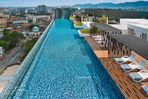 a large swimming pool on top of a building at The Horizon - Ipoh in Ipoh
