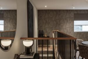 a room with a staircase with a mirror at 9 Kings, Hudson Quarters- FREE PARKING in York