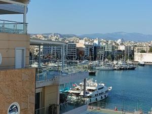 a group of boats docked in a marina at Athens Sky Suites 1 in Piraeus