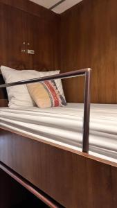 a close up of a bed on a boat at Baan Heart Thai in Chiang Mai