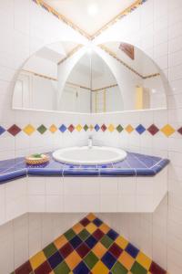 a bathroom with a sink and a mirror at YourHome - Casa Vittoria in Meta