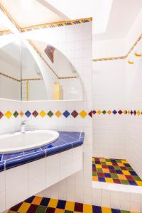 a bathroom with a sink and a mirror at YourHome - Casa Vittoria in Meta +21 photos