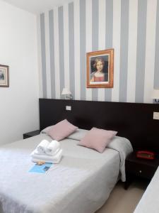 Postel nebo postele na pokoji v ubytování Hotel Ancore