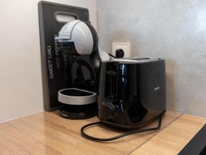 a coffee maker sitting on top of a counter at Duplex holiday apartment Rewal in Rewal