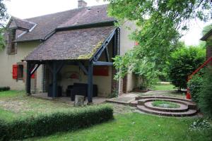 a house with a gazebo in the yard at BINDOUX in Les Lavis