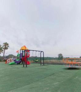 a park with a playground with a slide at Villa Marina di Pisticci - Matera in Marina di Pisticci