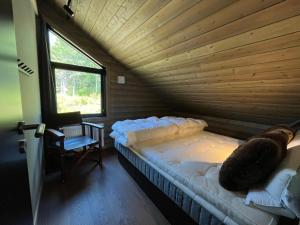 Postel nebo postele na pokoji v ubytování Skarvruet Lodge Funäsdalen