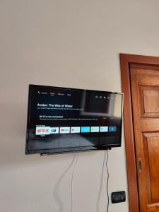 a flat screen tv hanging on a wall at B&B Colorado in Bergamo