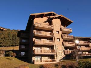 an apartment building with balconies on the side of it at Appartement Villard-sur-Doron, 5 pièces, 10 personnes - FR-1-594-226 in Villard-sur-Doron