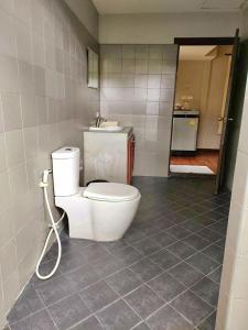 a bathroom with a toilet and a sink at Hua Hin Home Hill in Hua Hin