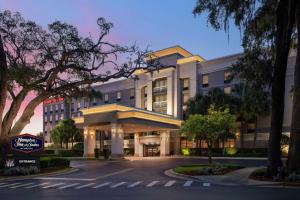 a rendering of the front of a hotel at Hampton Inn & Suites at Lake Mary Colonial Townpark in Lake Mary