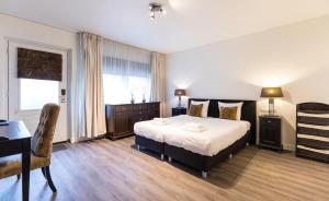 Postel nebo postele na pokoji v ubytování Hotel de Duif Lisse - Keukenhof + 37 fotografií