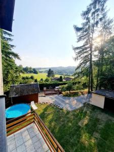 a view of a backyard with a swimming pool at Bohemian Paradise near Prague with Wellness in Řehenice