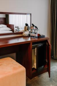 a wooden desk with a microwave in a hotel room at Willa Plażowa in Międzyzdroje