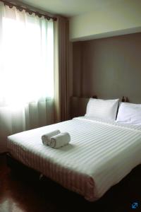 Säng eller sängar i ett rum på Lux Rooms Night Bazaar