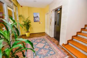 a hallway with stairs and a rug on the floor at Karacan Park Hotel - Dalaman Airport in Dalaman