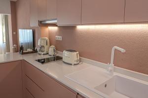 a kitchen with two toasters on a counter at Bono Residence in Marmaris +10 photos