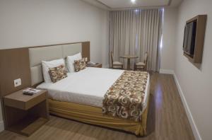 Кровать или кровати в номере Mirador Rio Copacabana Hotel